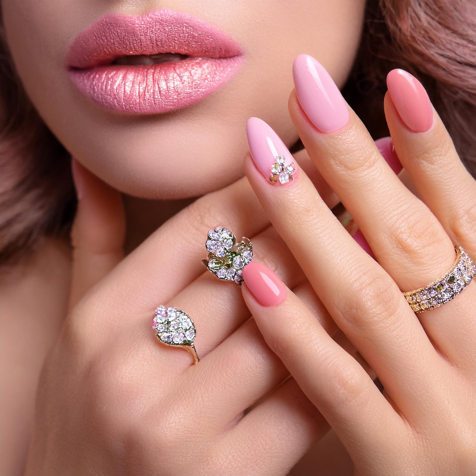 woman-with-pink-nail-polish-diamond-ring